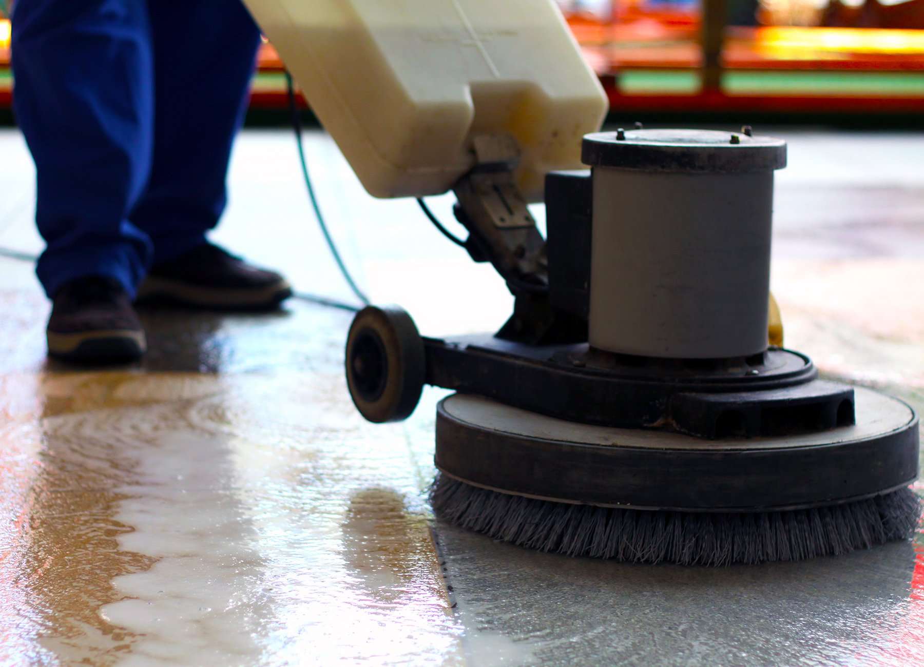 A floor scrubber being used to clean commercial floors